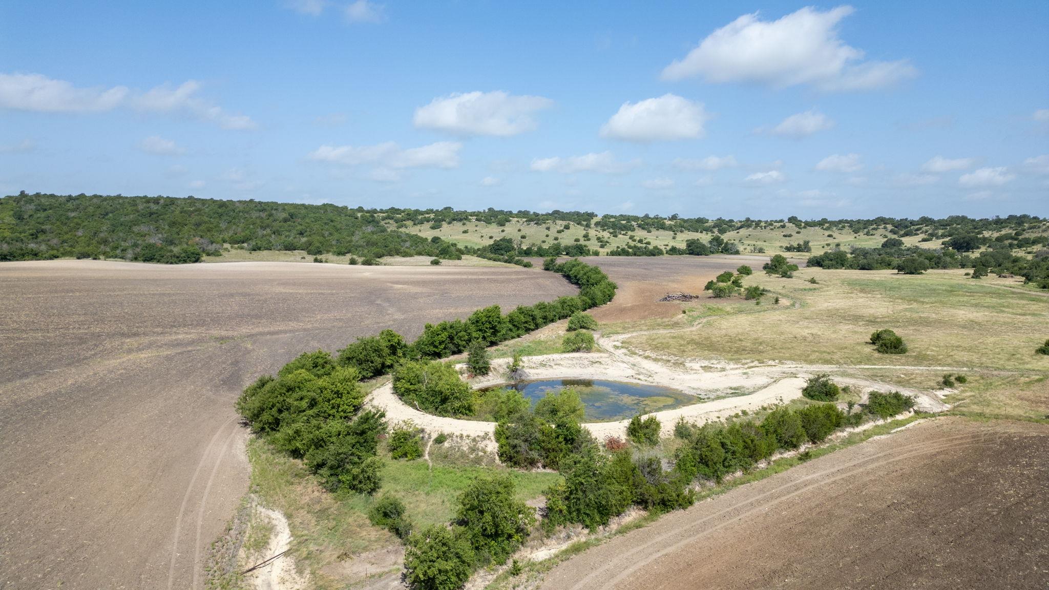 Cultivated fields meet natural beauty with a char