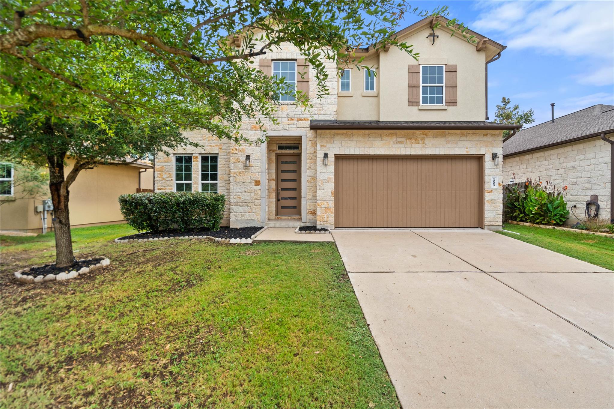 A striking exterior combines stone and stucco wit