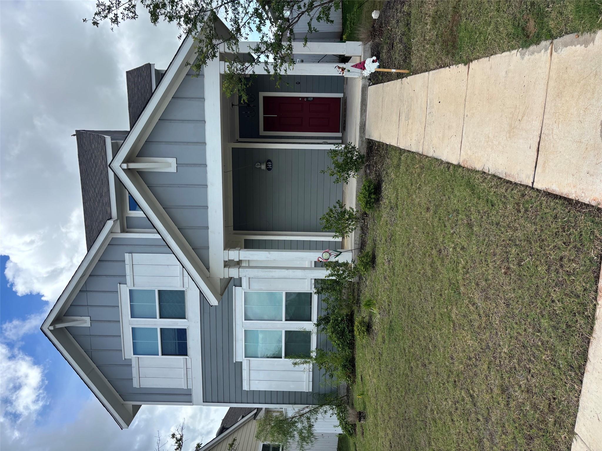 A welcoming facade with a covered entry and well-