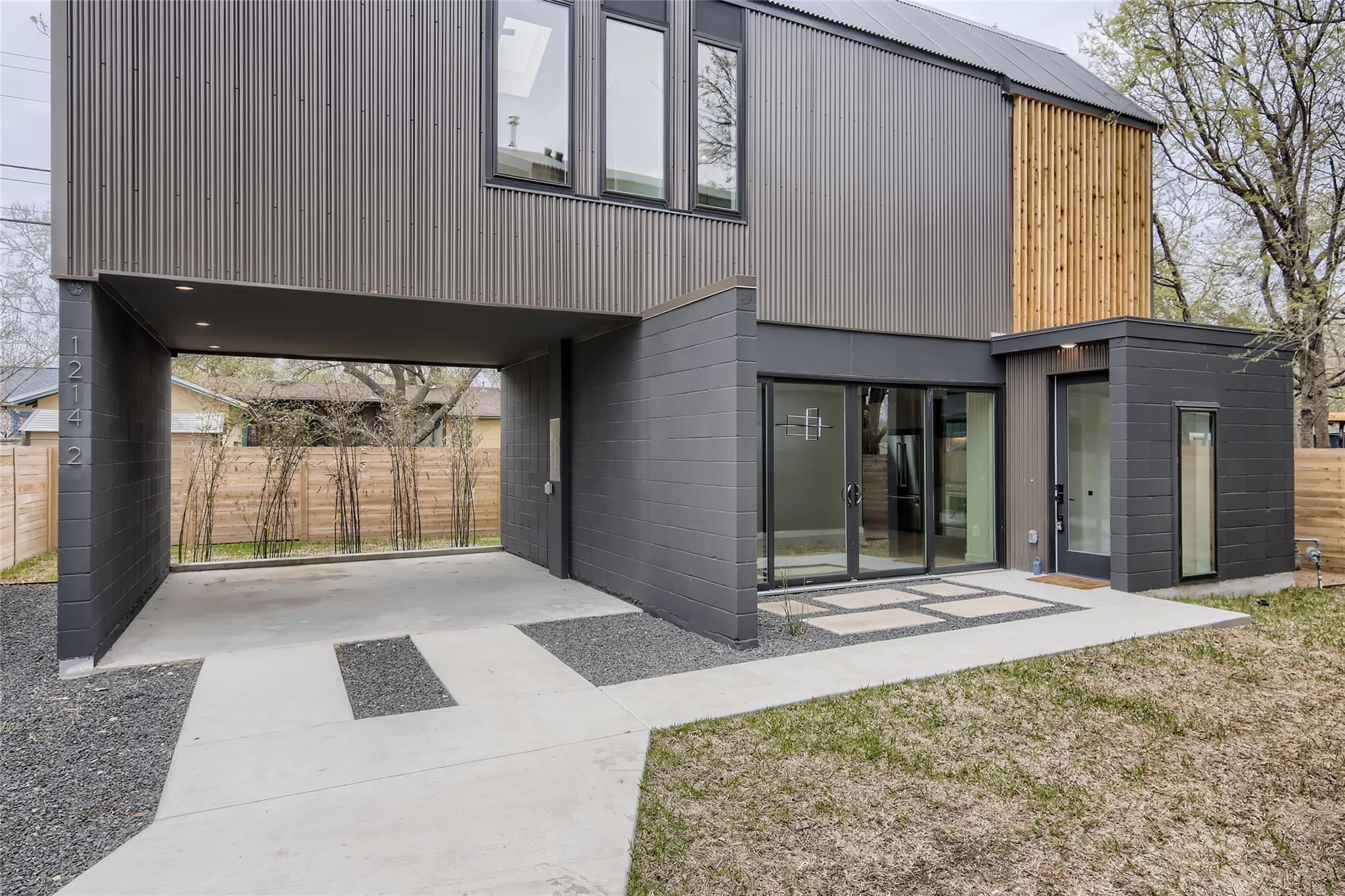 A striking modern facade features mixed materials