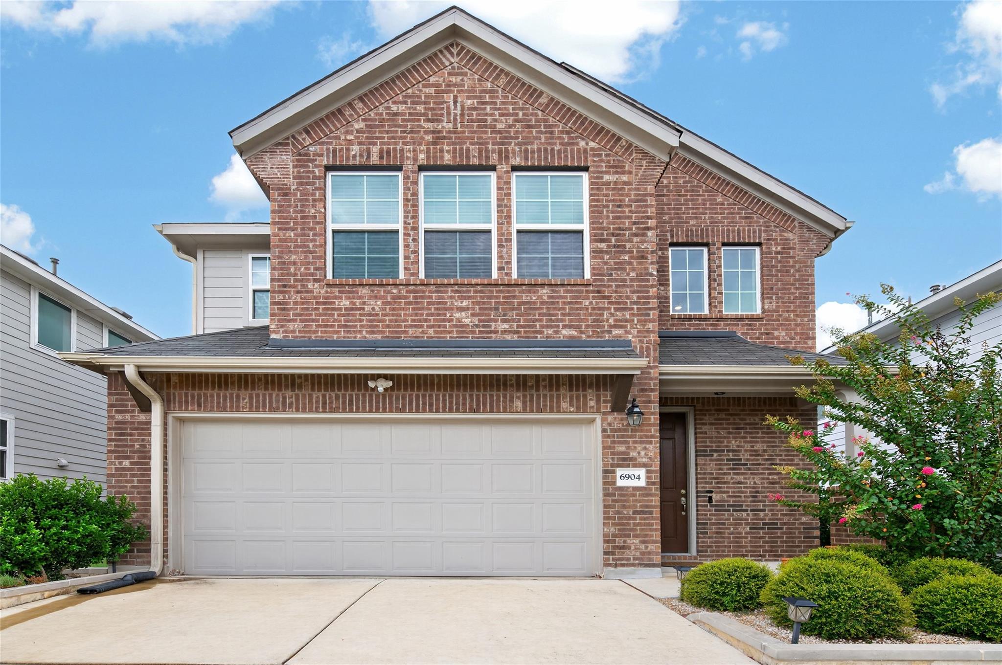 A classic brick exterior with a welcoming entrywa