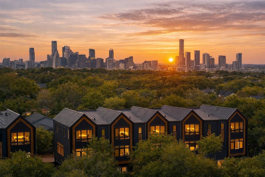 City skyline views with a vibrant sunset over a m