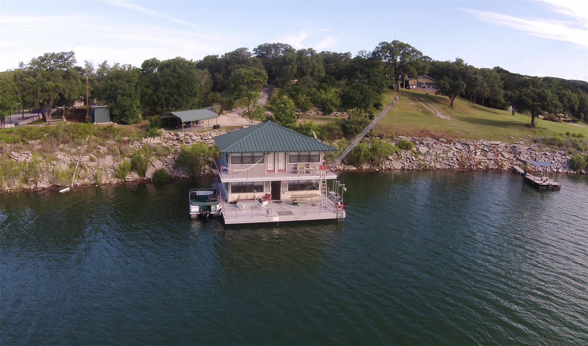 Perched on the lake's edge, this charming house o