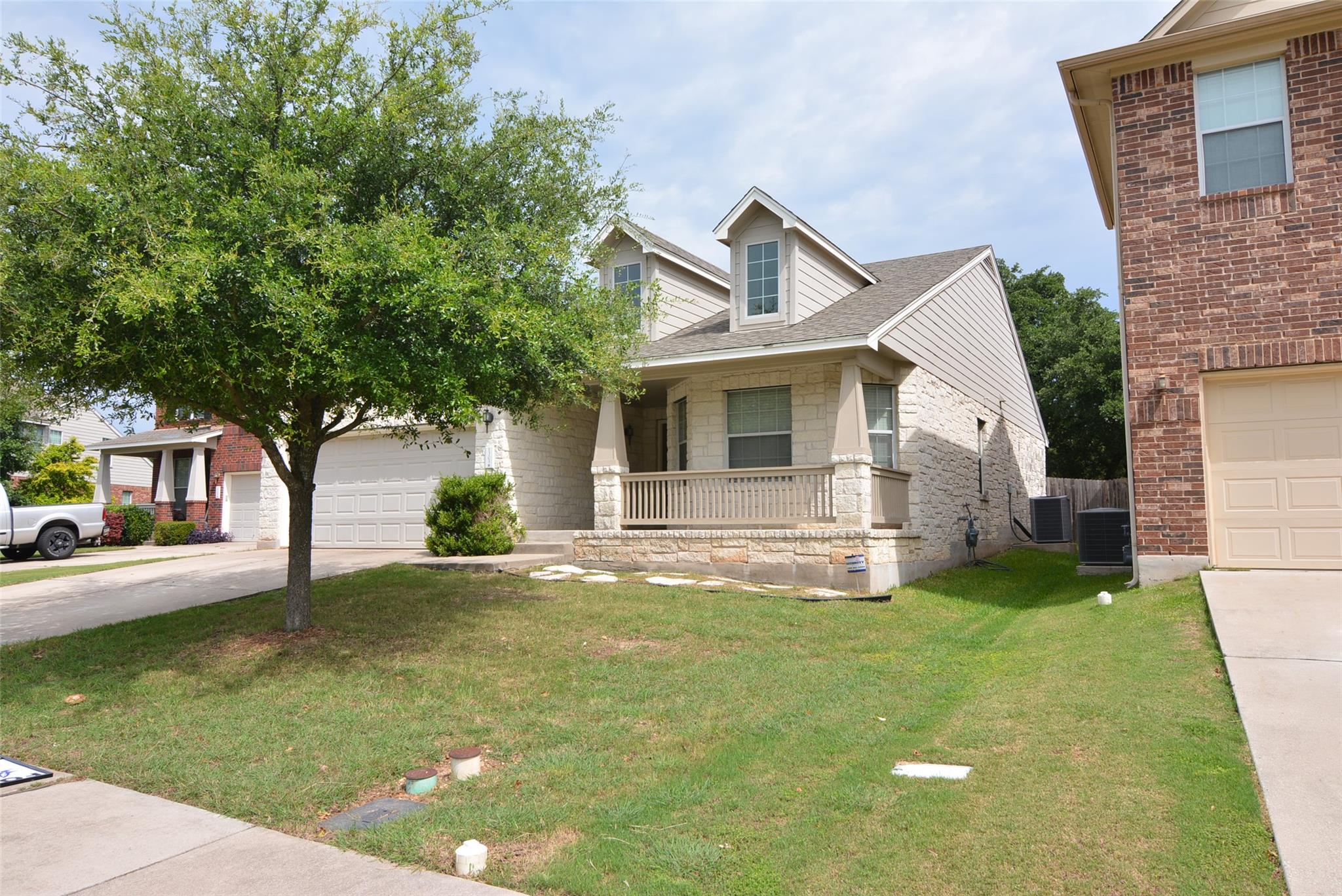 A charming home boasts a welcoming front porch, a