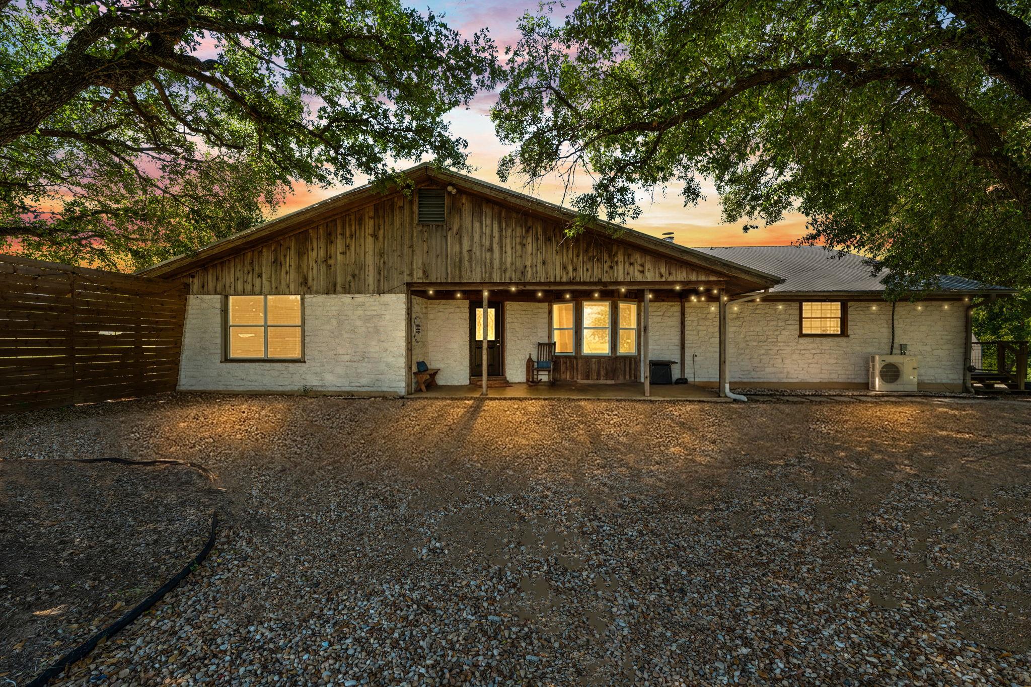Mature trees canopy this inviting home, offering 