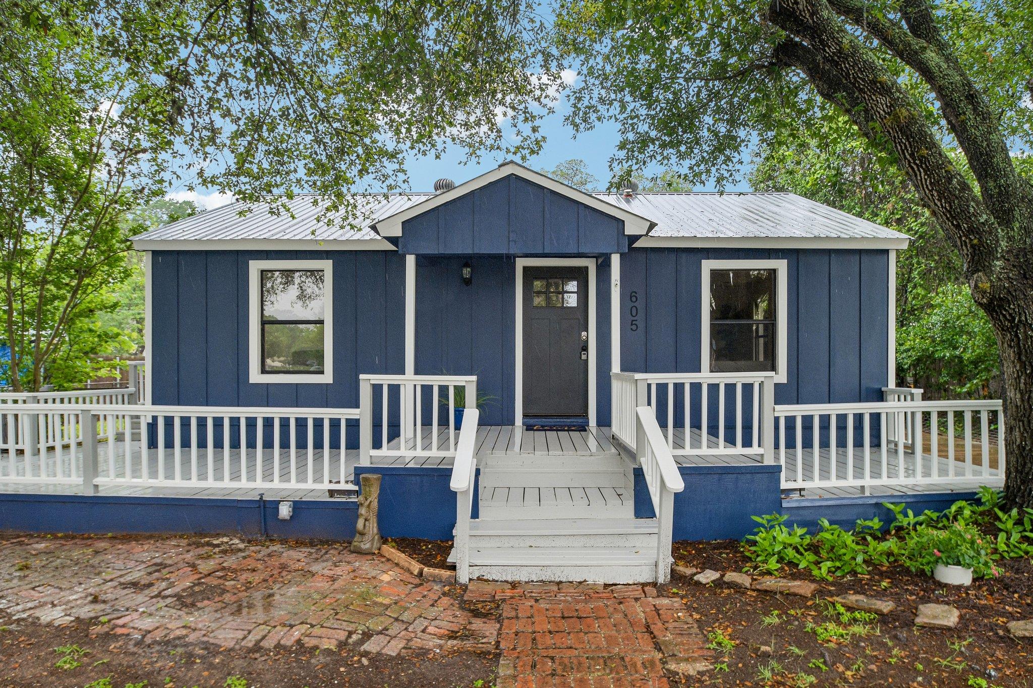 Blue exterior with white trim, featuring a corrug