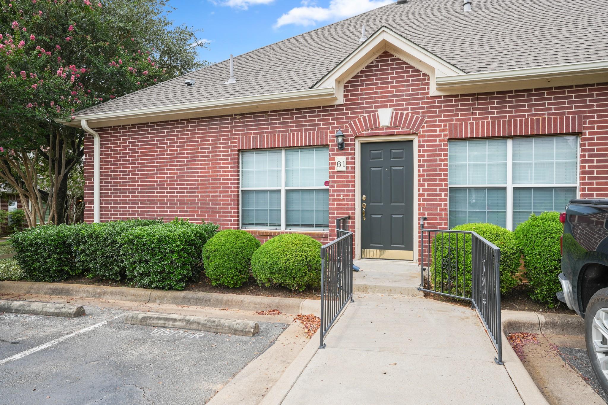 A welcoming brick exterior greets visitors, compl