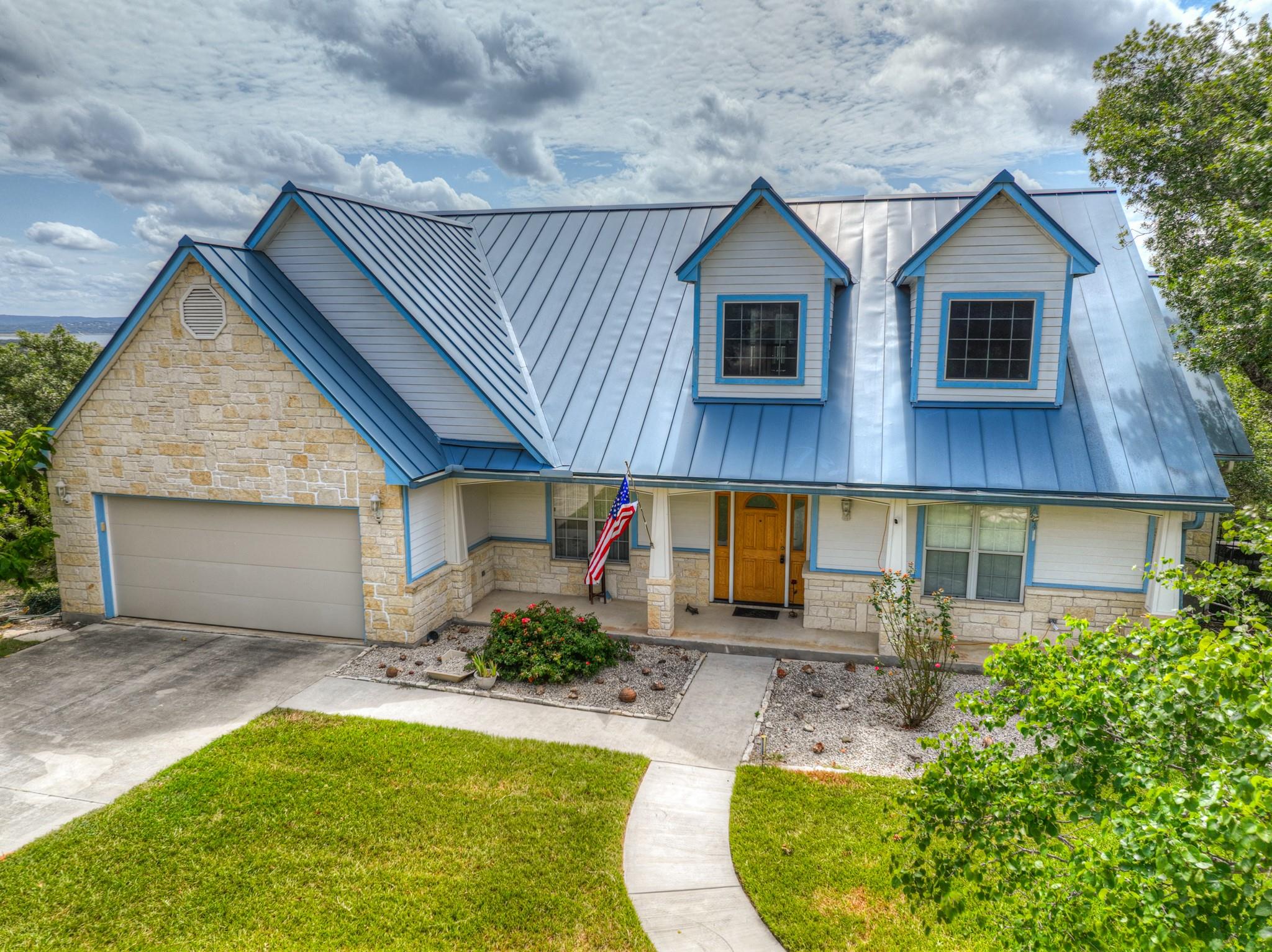 Distinctive blue metal roof crowns this appealing