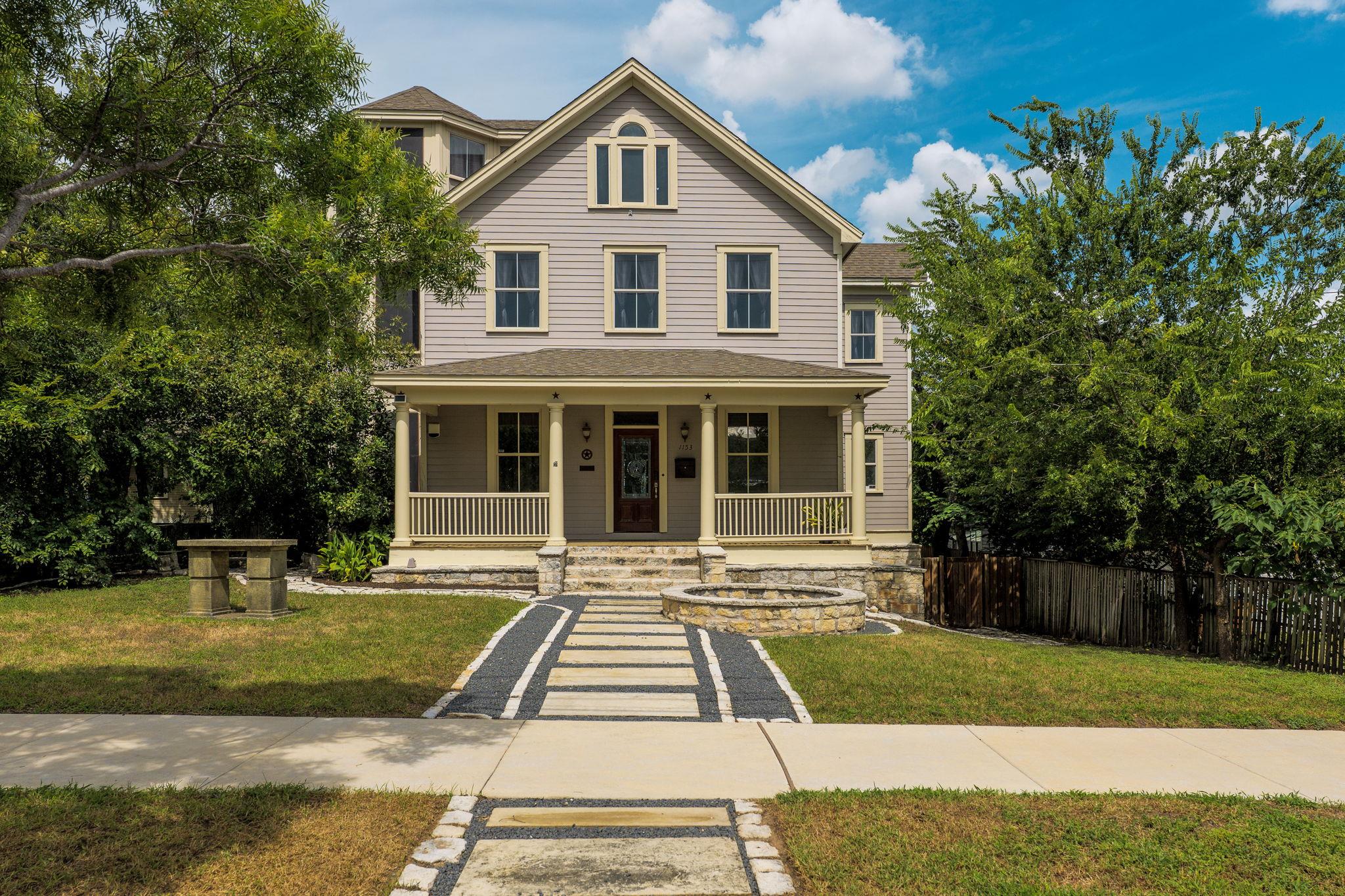 A charming porch welcomes you to this distinctive