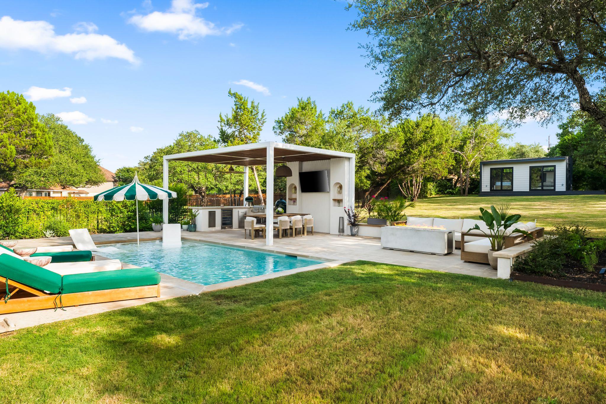 An inviting backyard oasis offers a sparkling in-