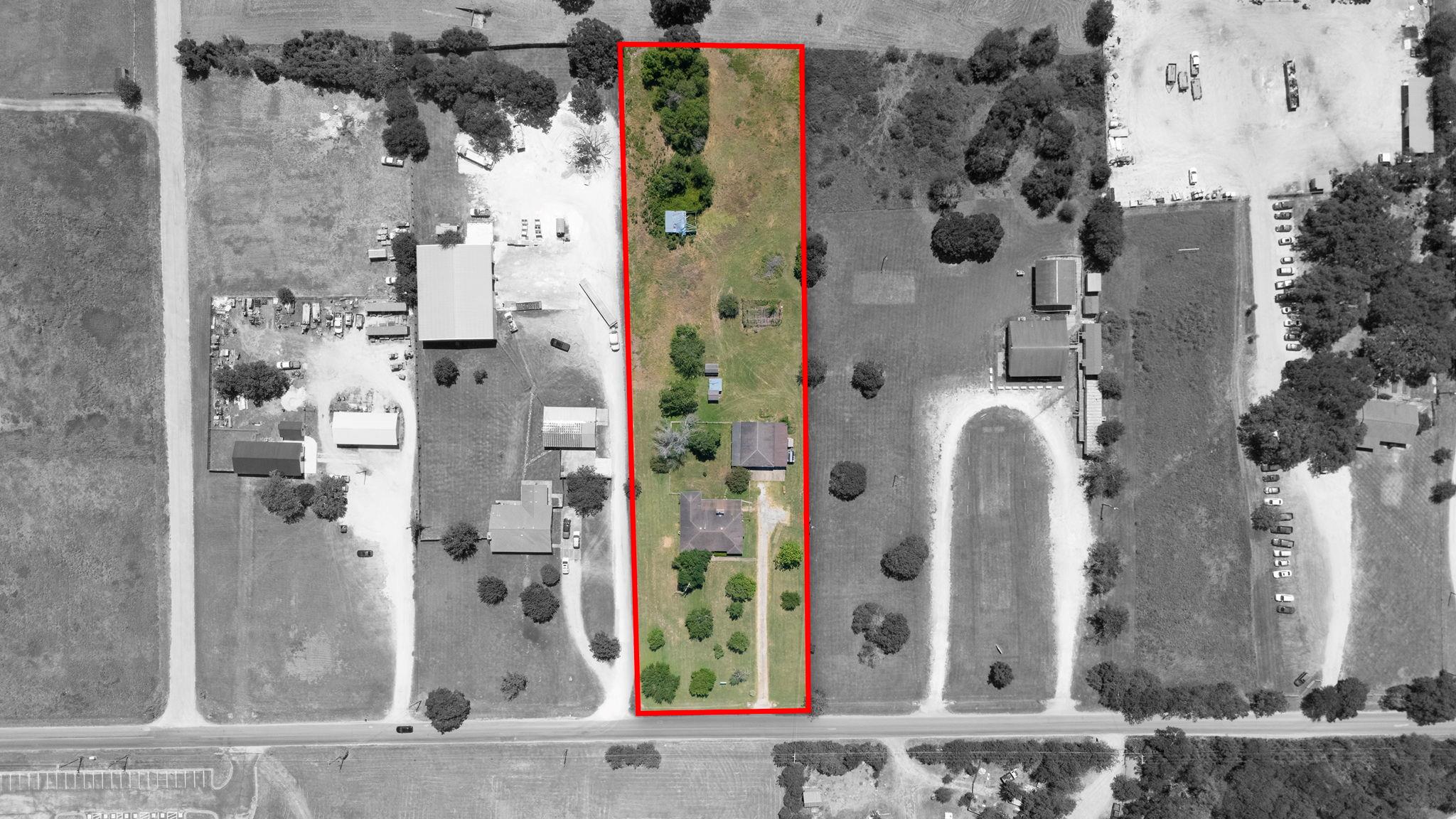 An aerial perspective reveals a long, narrow plot