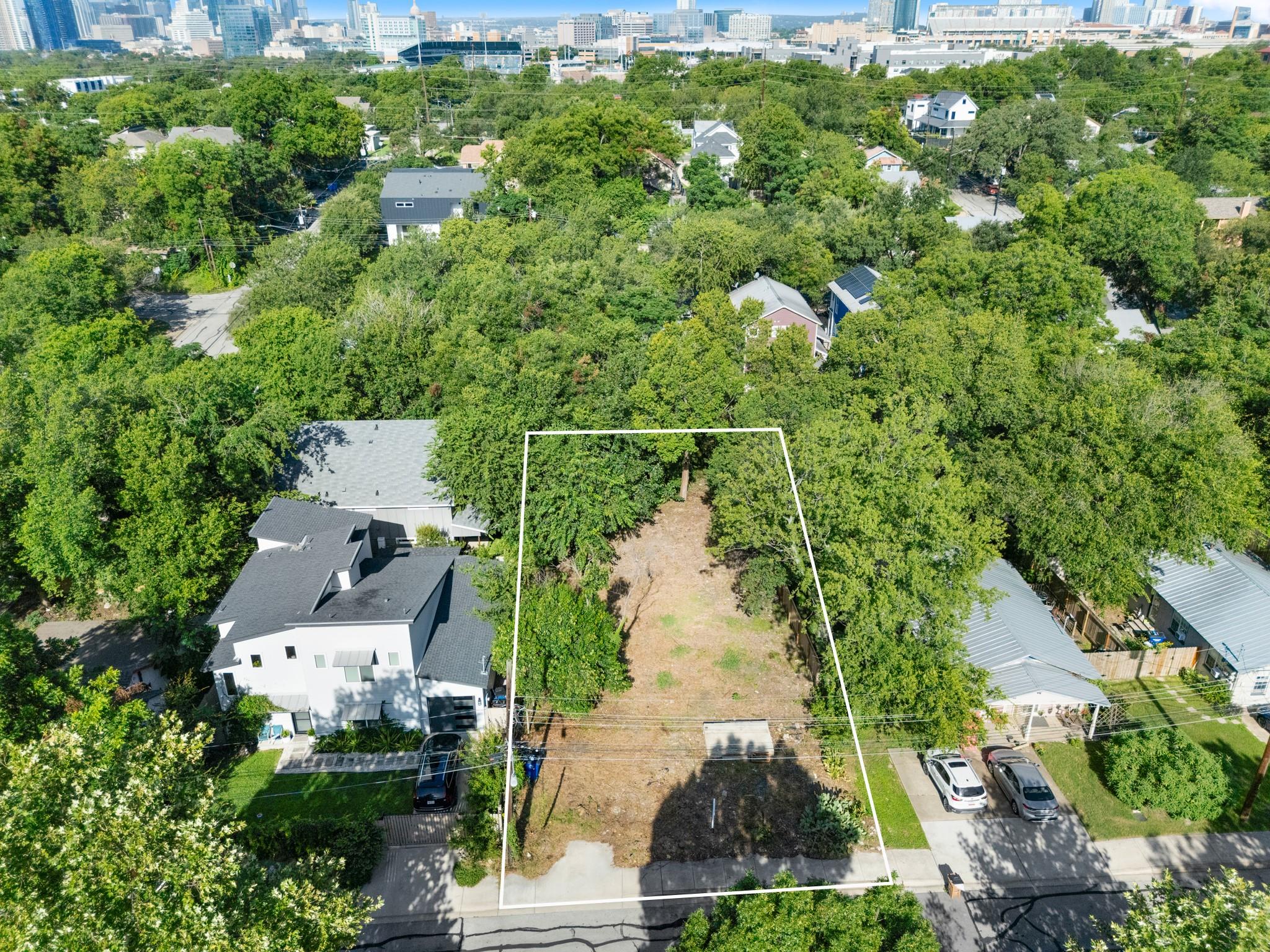 A valuable buildable lot awaits amidst a verdant 