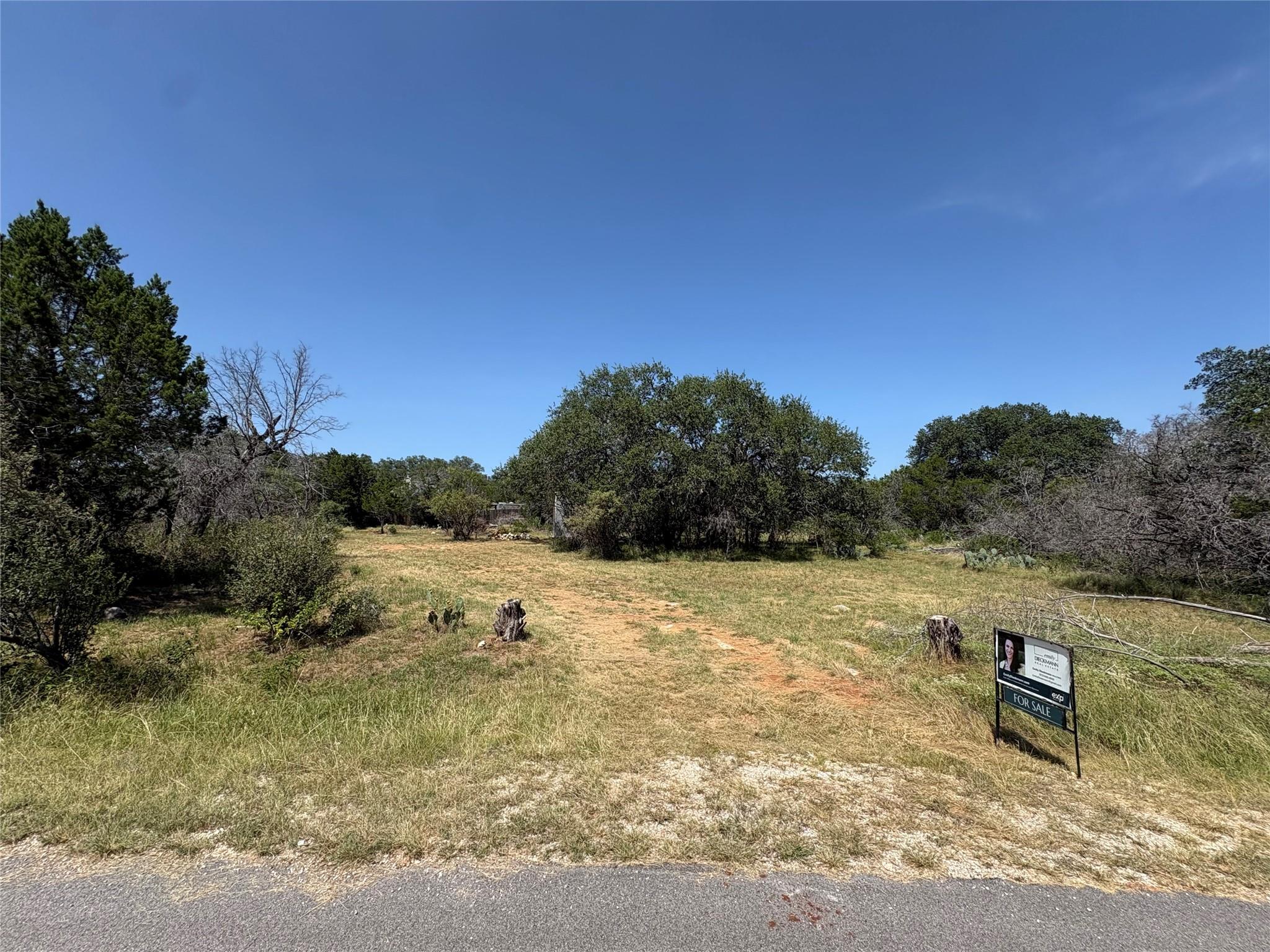A spacious, naturally landscaped lot offers ample