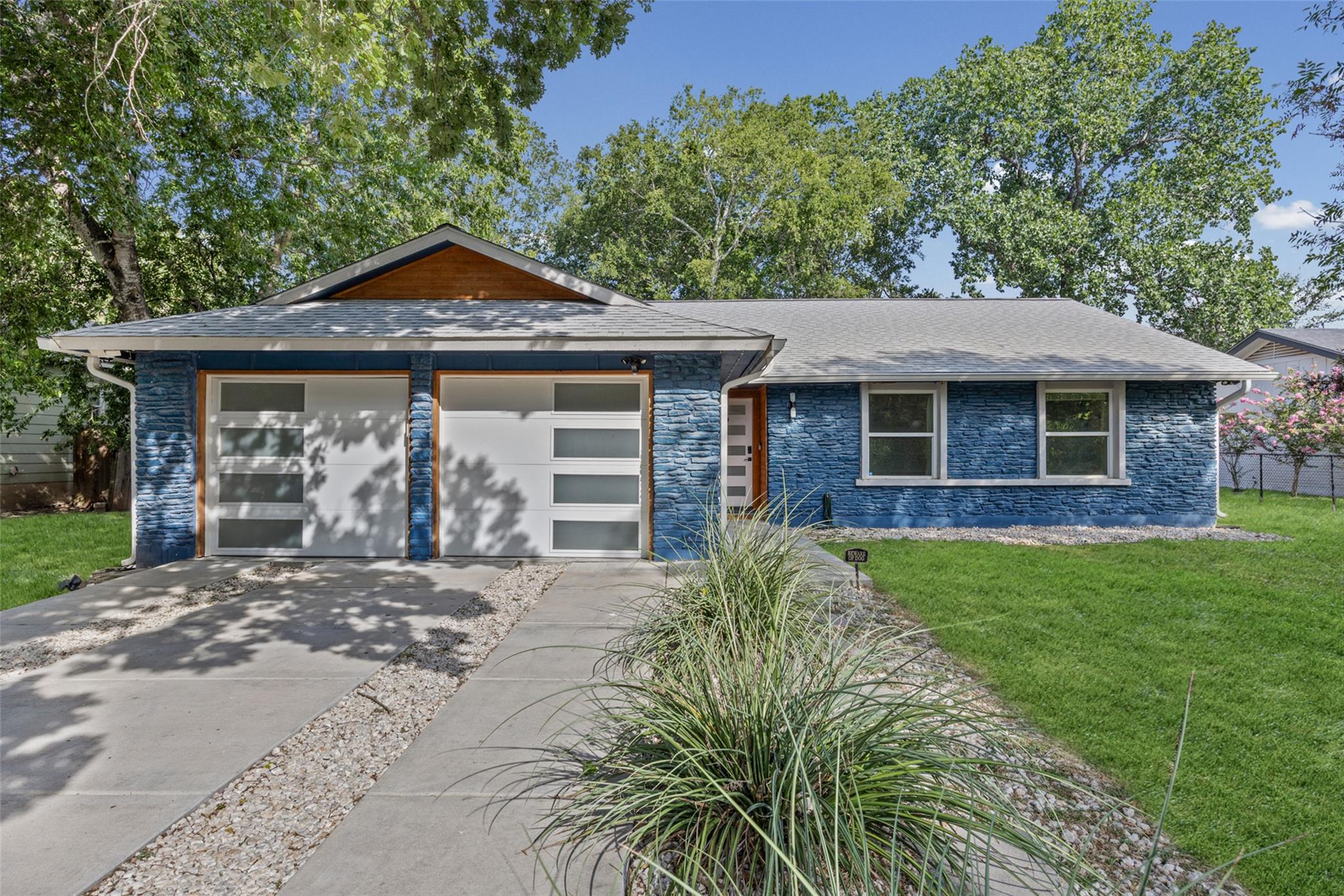 Modern blue stone facade with contemporary garage