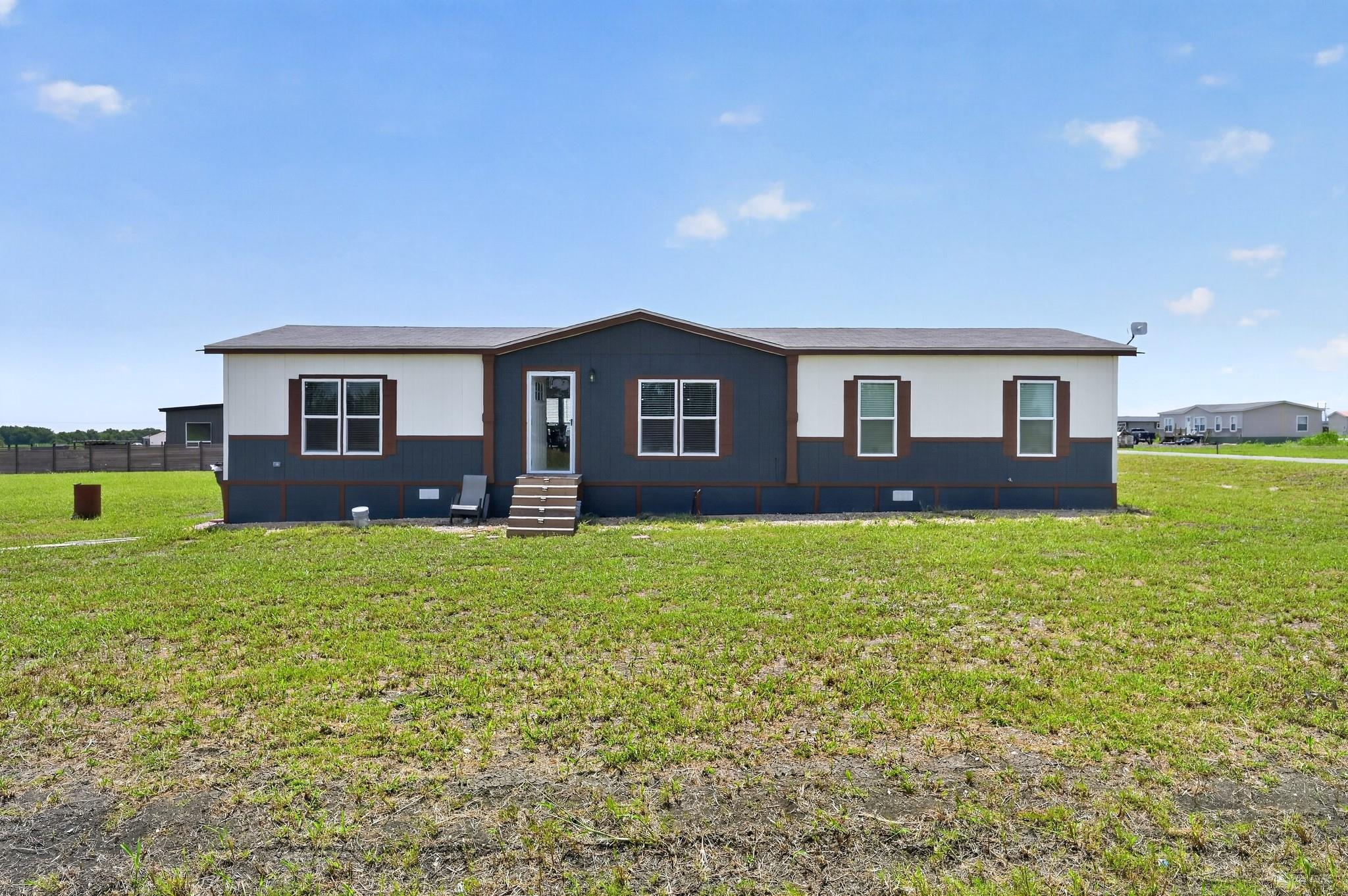A classic modular home with contrasting siding of