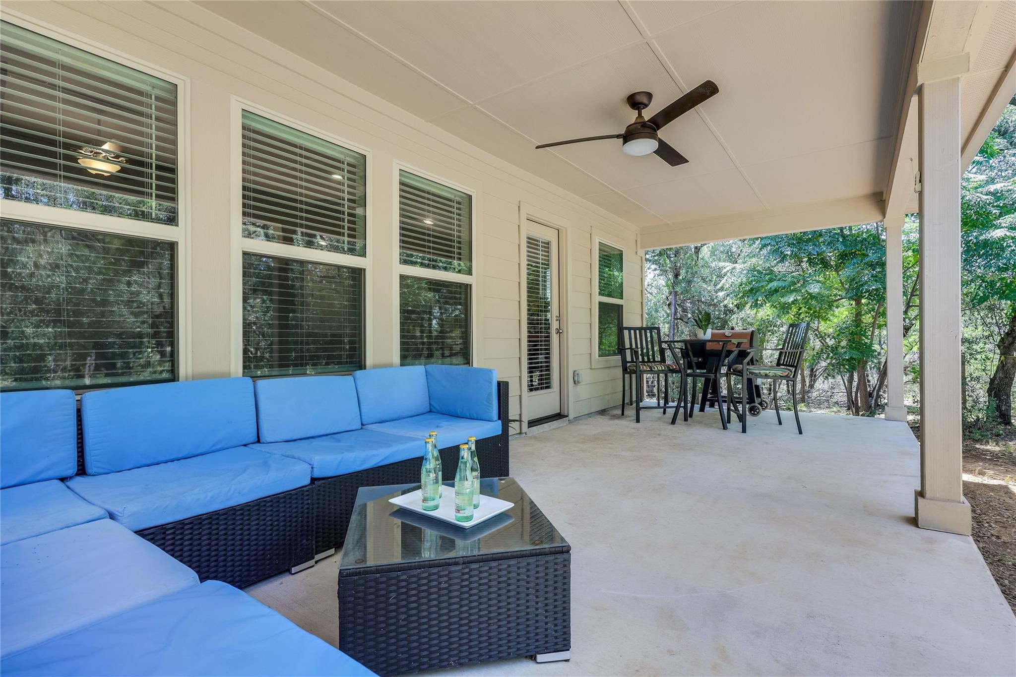 An inviting covered patio offers a comfortable ou