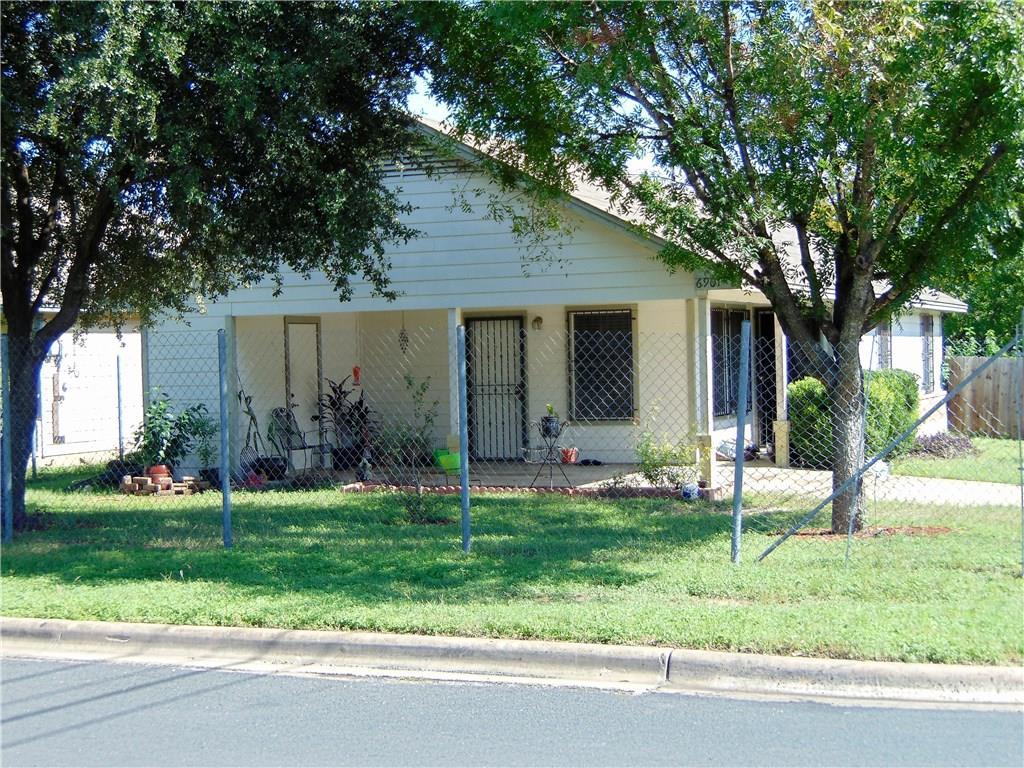 A modest home with a welcoming covered front porc