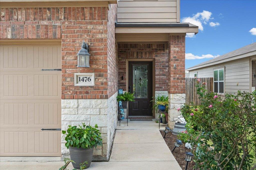 A welcoming brick and stone facade leads to a fro