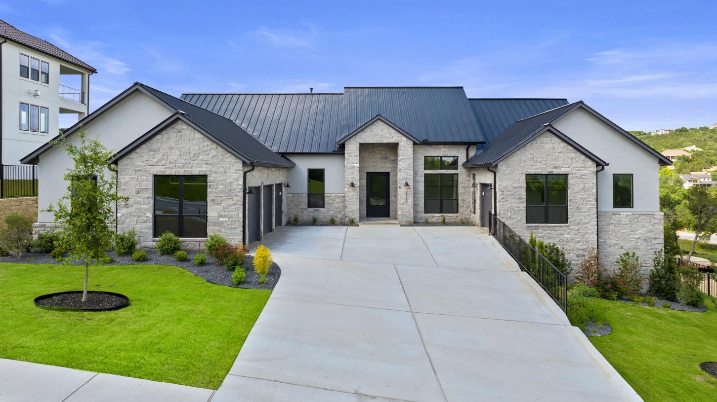 A striking modern facade with stone accents and a