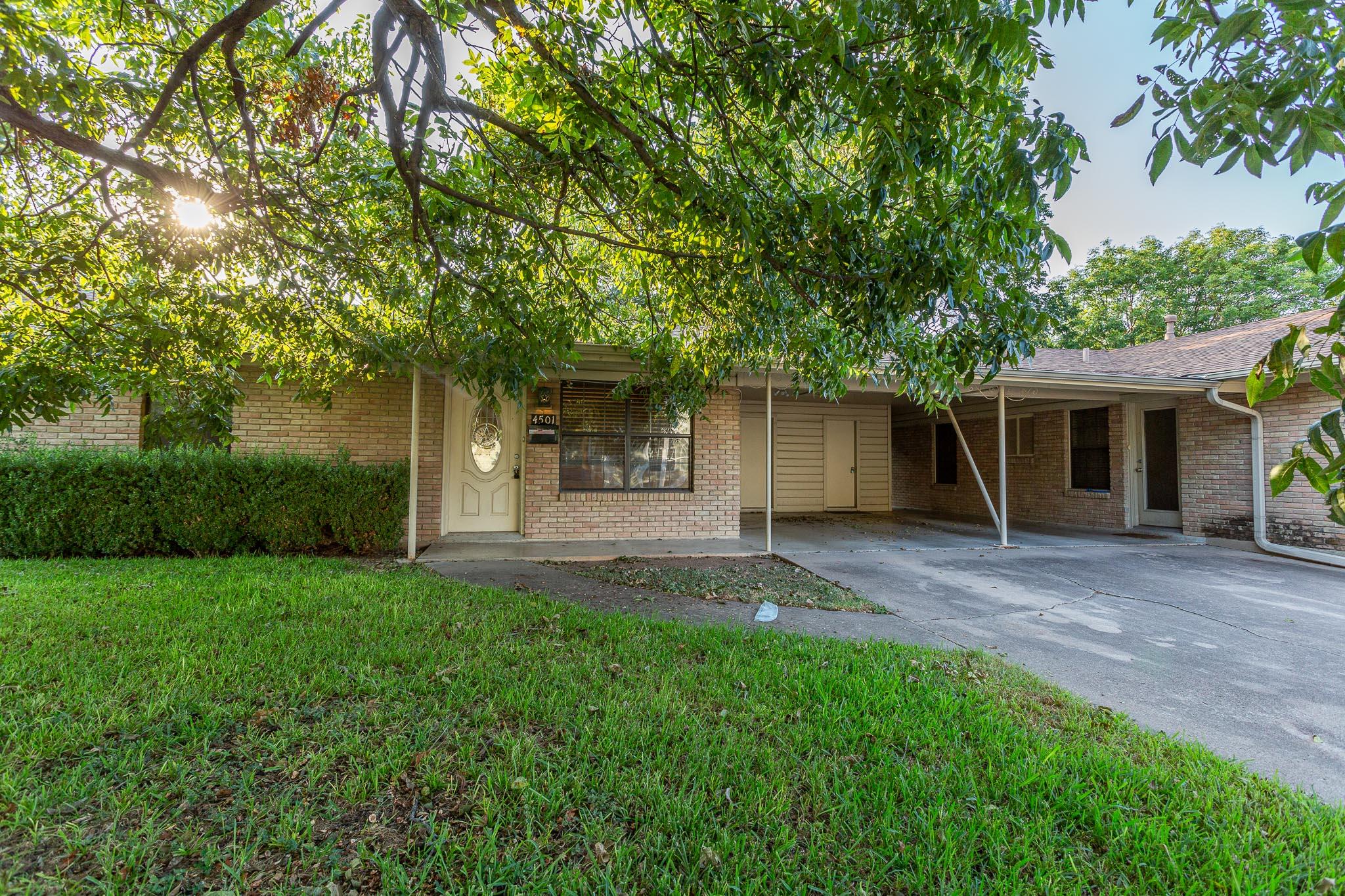 A well-maintained brick exterior residence with a