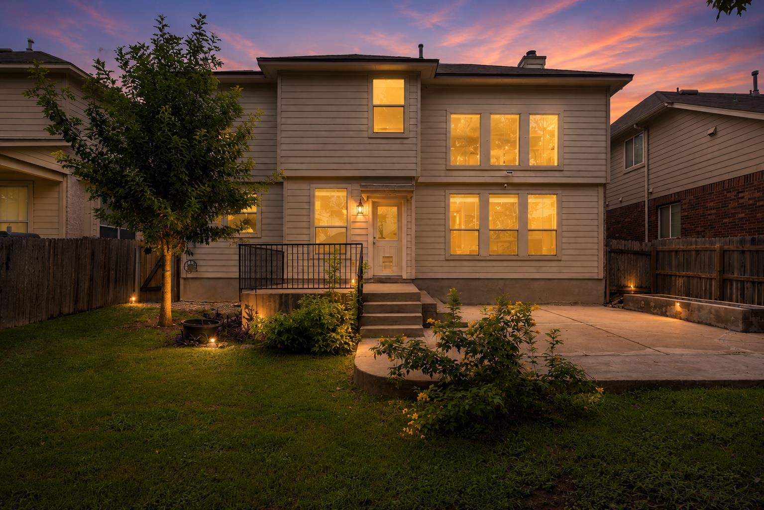 A private backyard oasis with ample patio space f