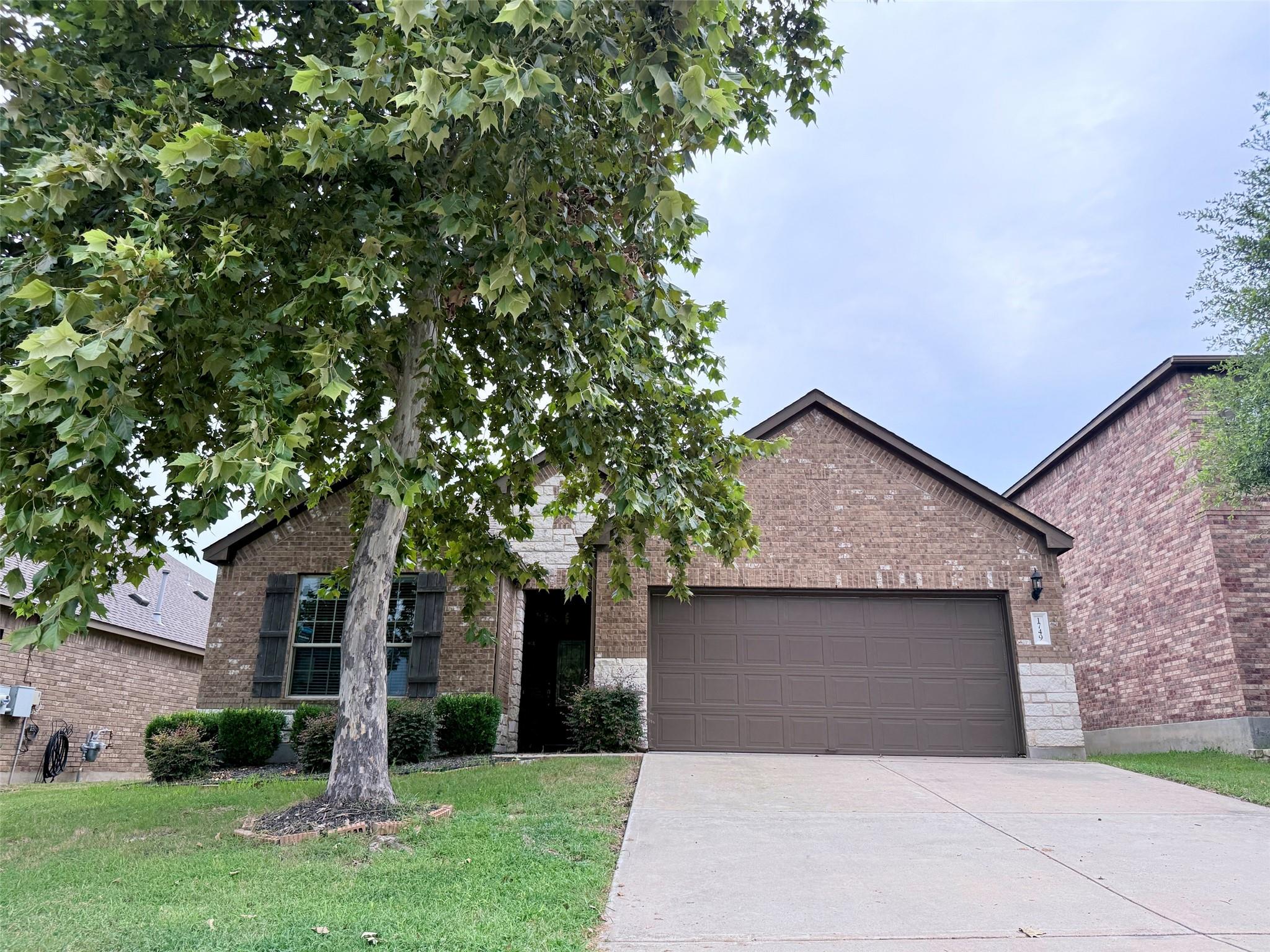 A well-maintained brick and stone facade welcomes