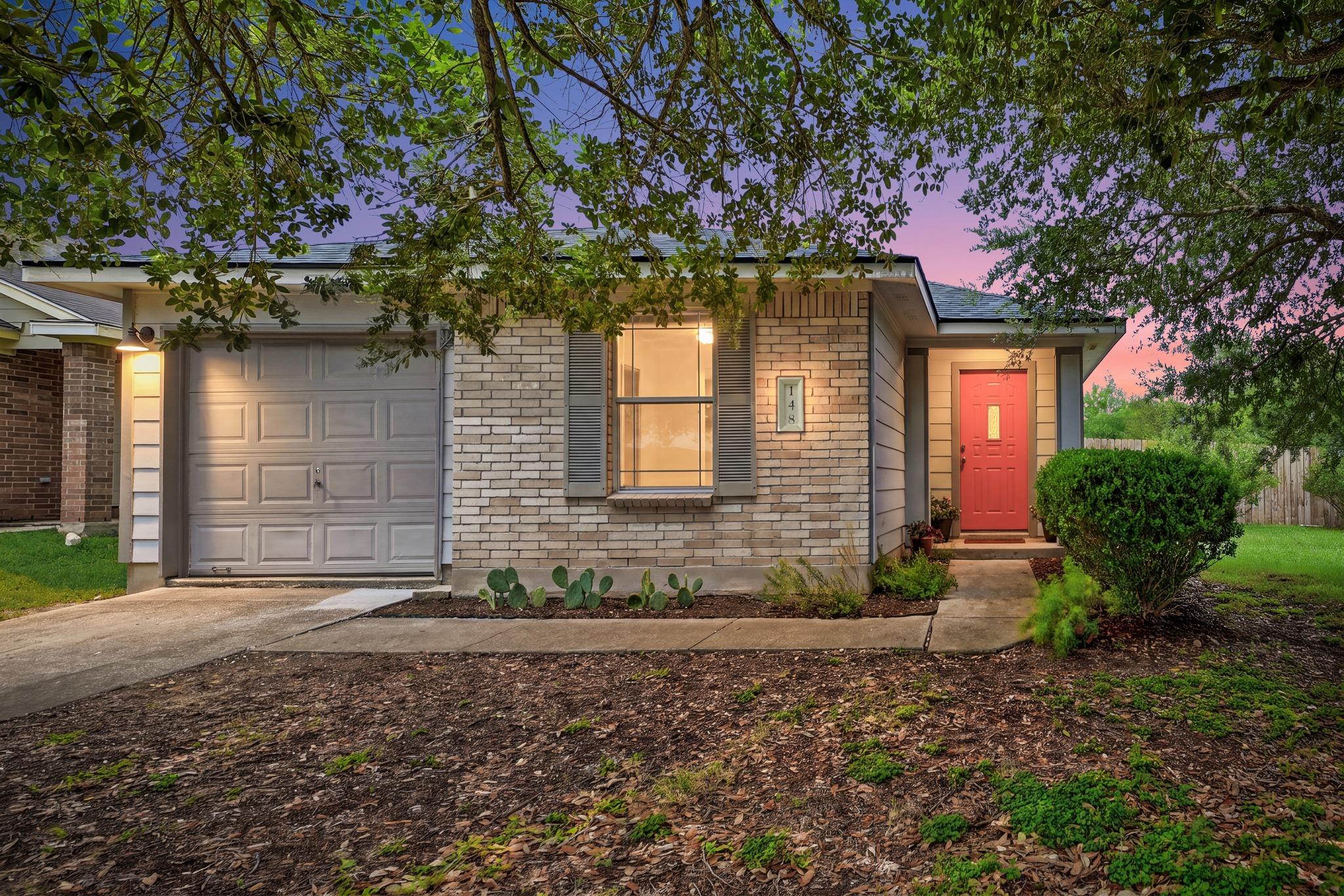 A charming single-story home presents a vibrant r