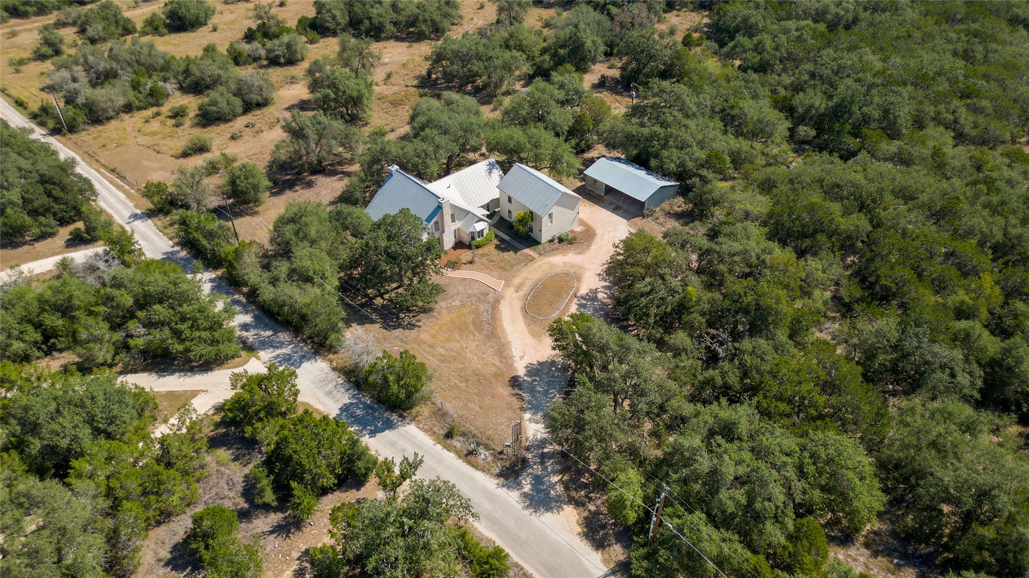 Mature trees surround this private rural estate w