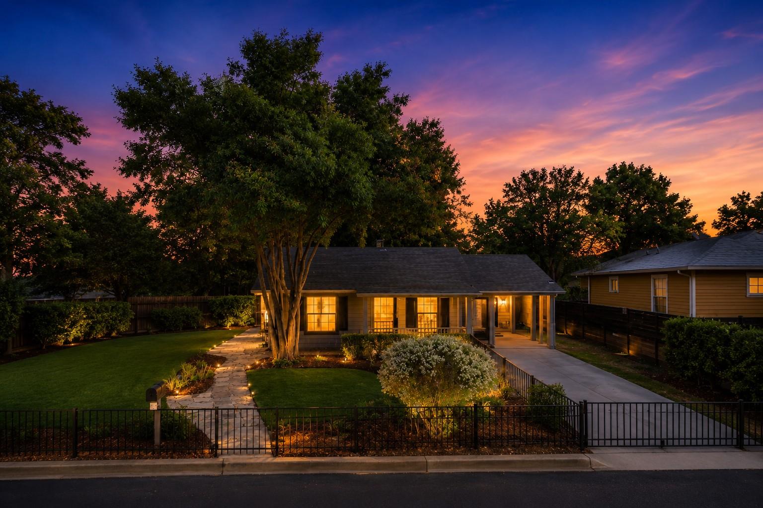 Illuminated by a vibrant sunset, this charming ho