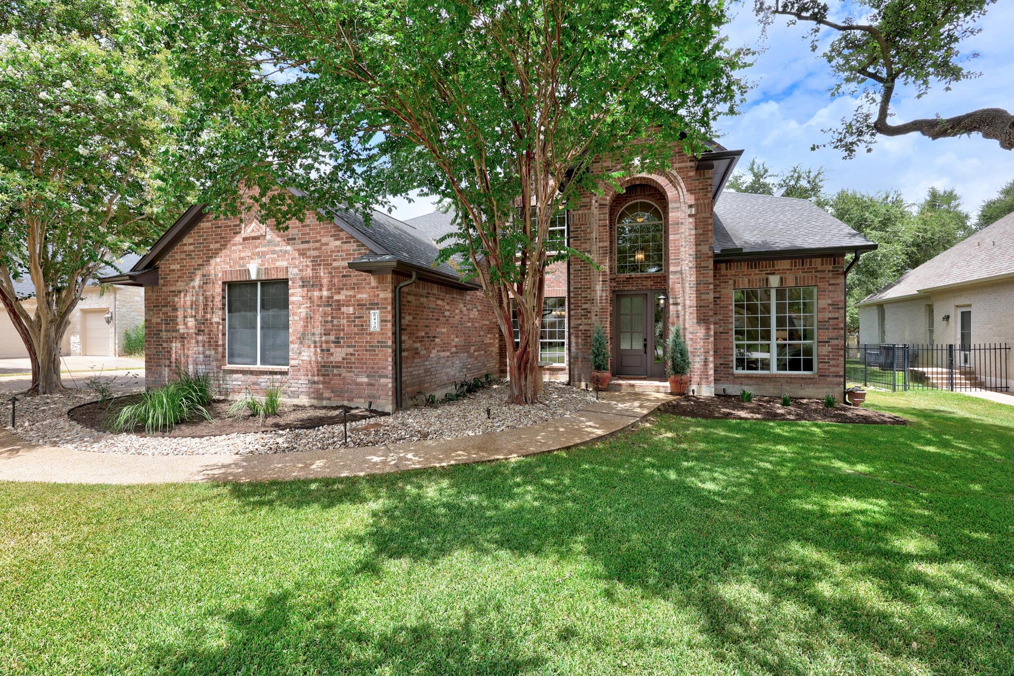 An inviting brick facade with a graceful archway 