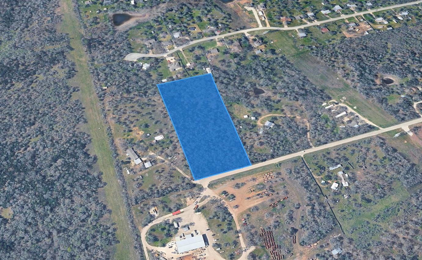 A spacious, rectangular lot awaits development am