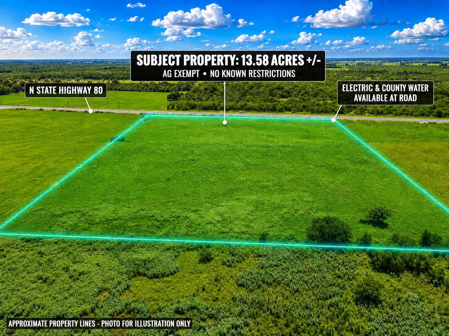 An expansive green pasture stretches toward the h