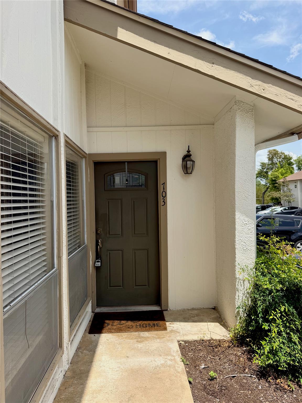 A welcoming entry, with a classic exterior door a
