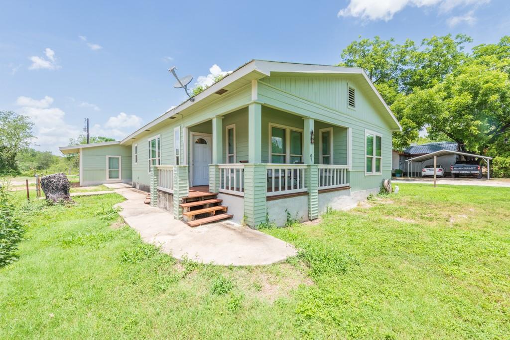 A welcoming front porch enhances this charming re