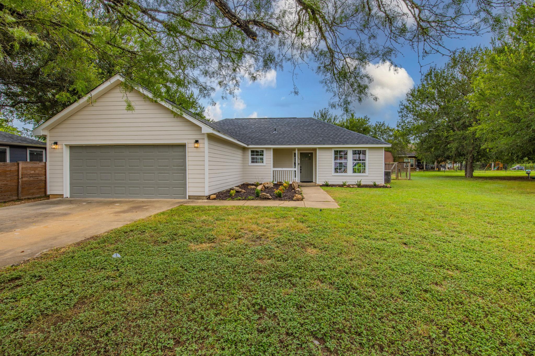 A well-maintained single-story residence with a g