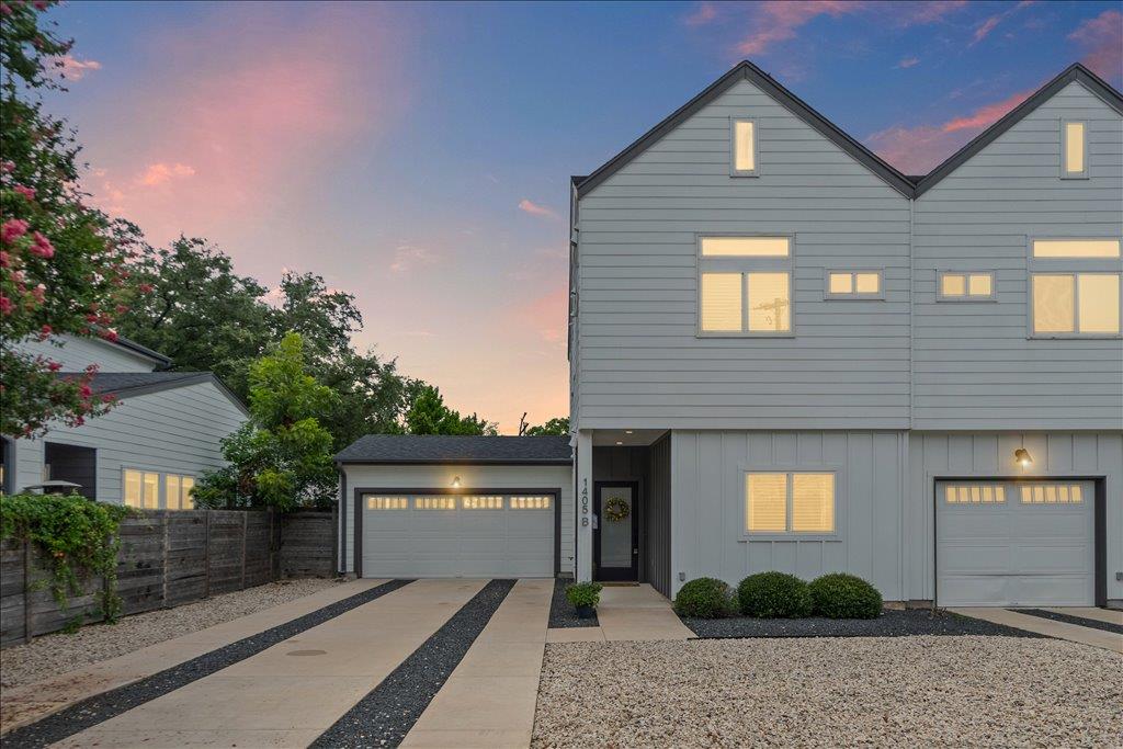 Modern townhome exterior with well-maintained lan