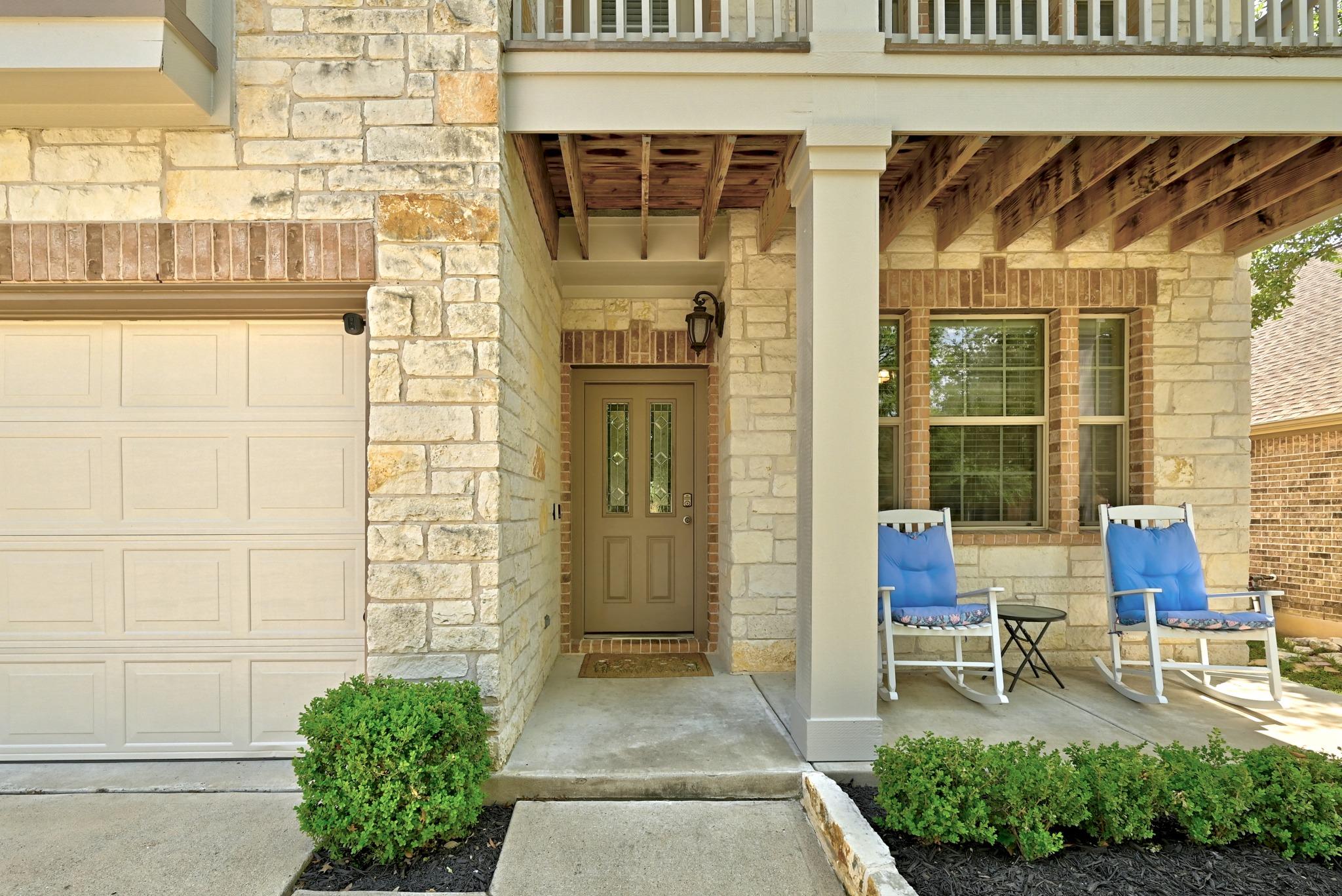 A welcoming stone facade with a covered porch and