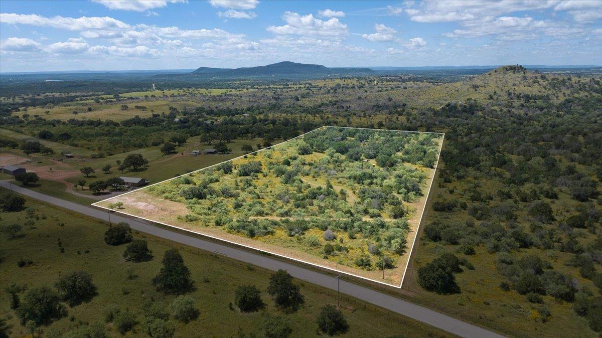 A generous parcel of land awaits, framed by verda