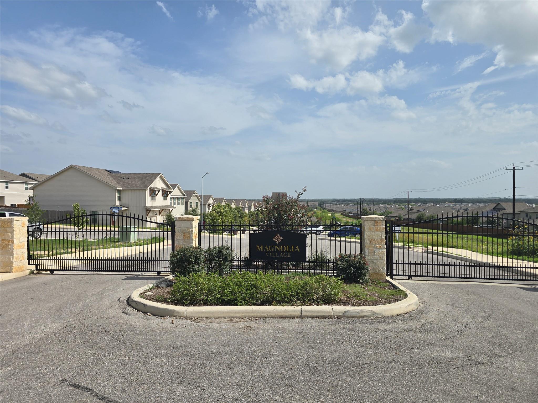 Secure community entry with an ornate wrought iro