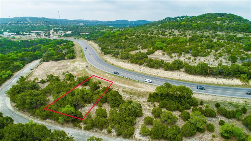 A prime lot along a winding road awaits your visi