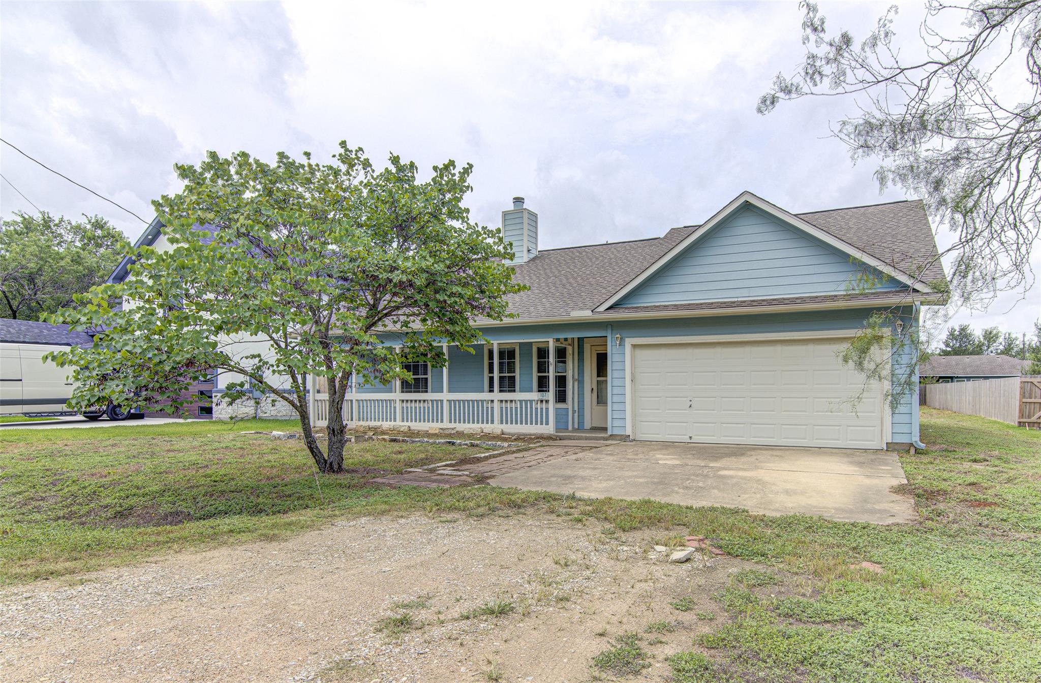 A welcoming light blue home presents a classic co