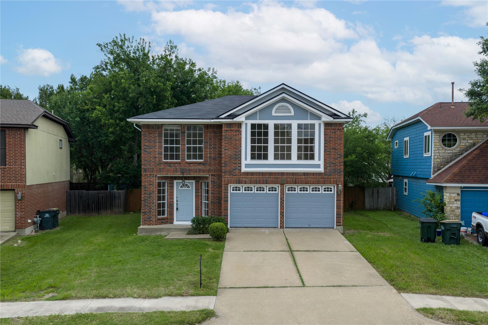 A well-maintained brick and siding two-story home