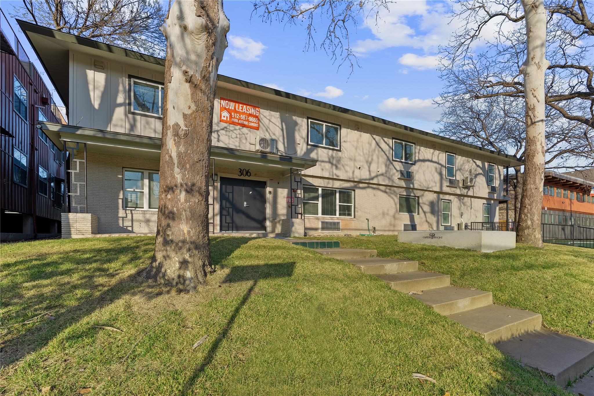 A mid-century modern apartment building facade wi