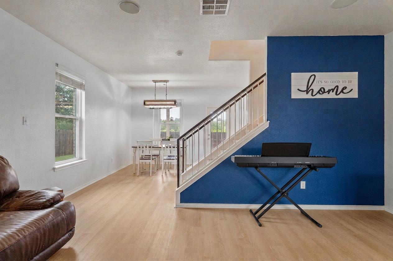 Gleaming hardwood floors and a modern staircase d