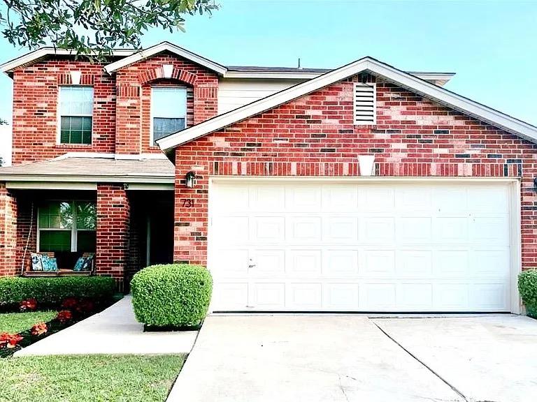 A classic brick facade with a welcoming front por