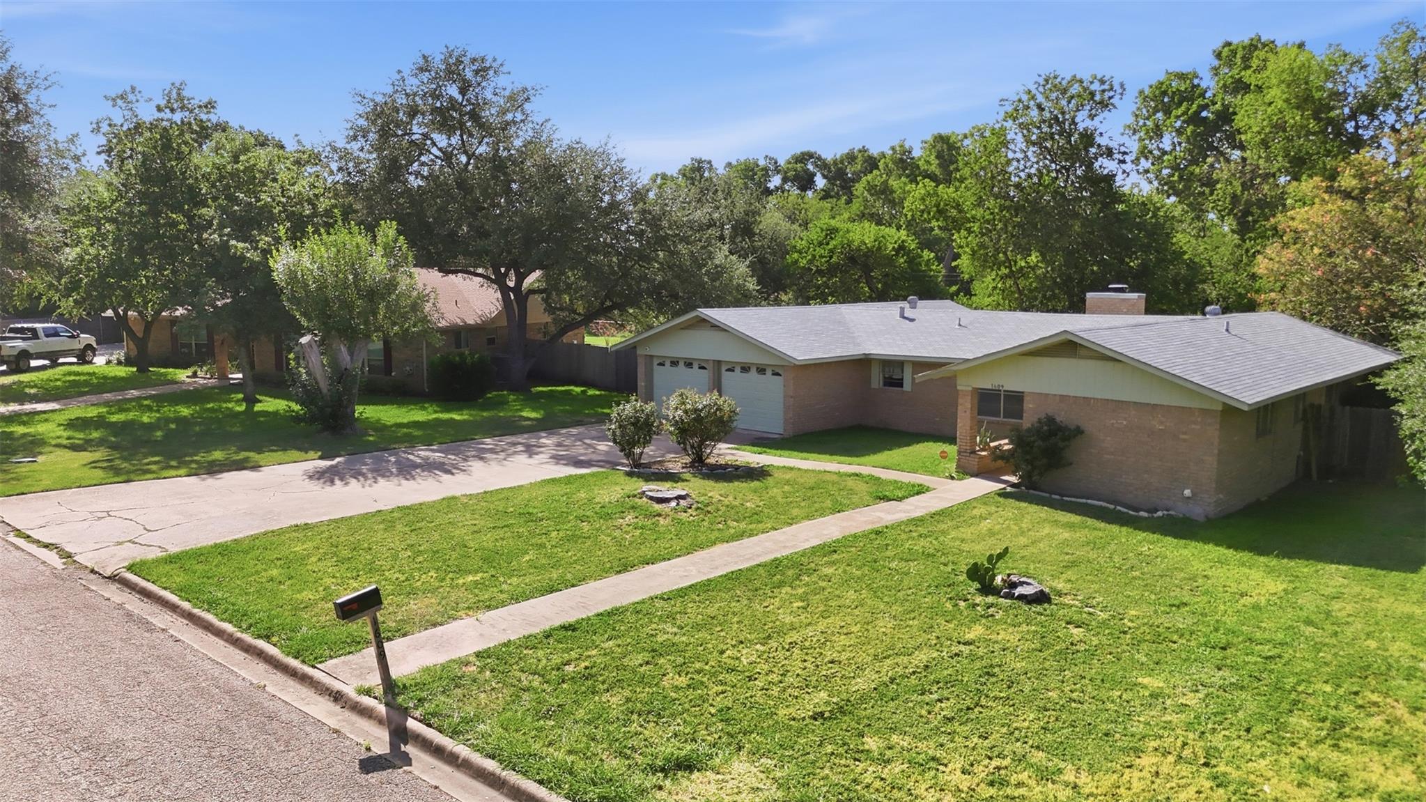 A well-maintained lawn welcomes visitors to this 