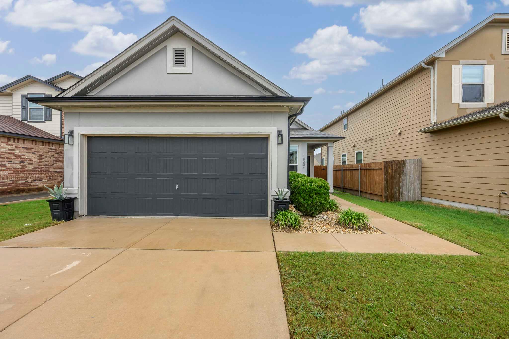 A well-maintained facade with a private garage we