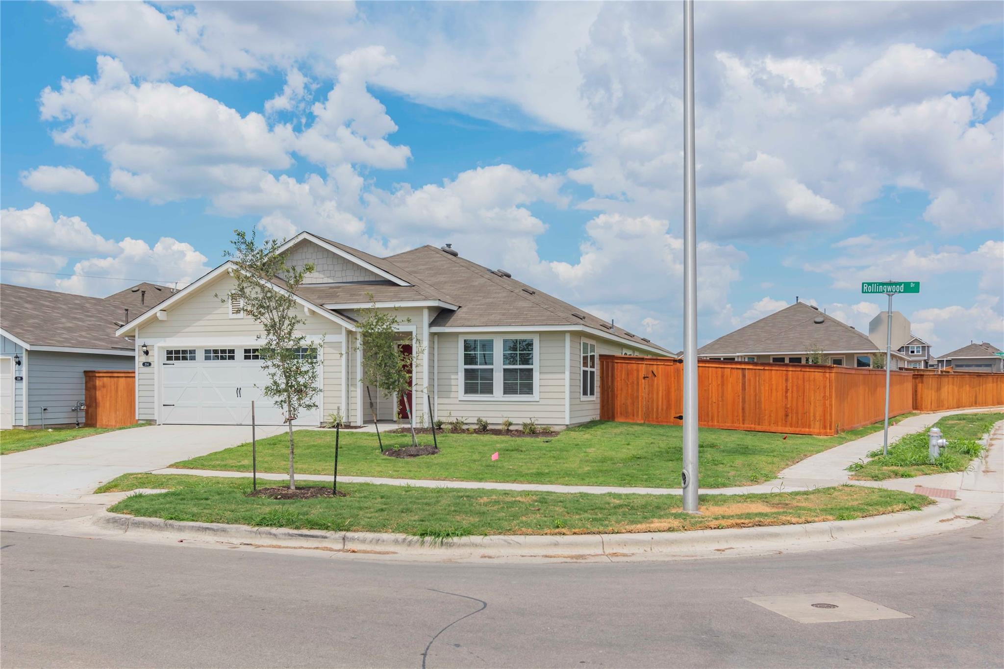A welcoming corner lot residence featuring a well