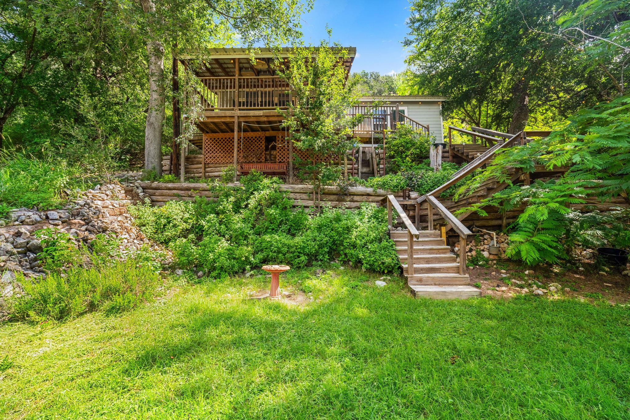 A secluded dwelling nestled amidst verdant trees,
