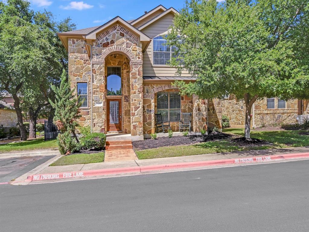 A striking stone and brick facade with an arched 